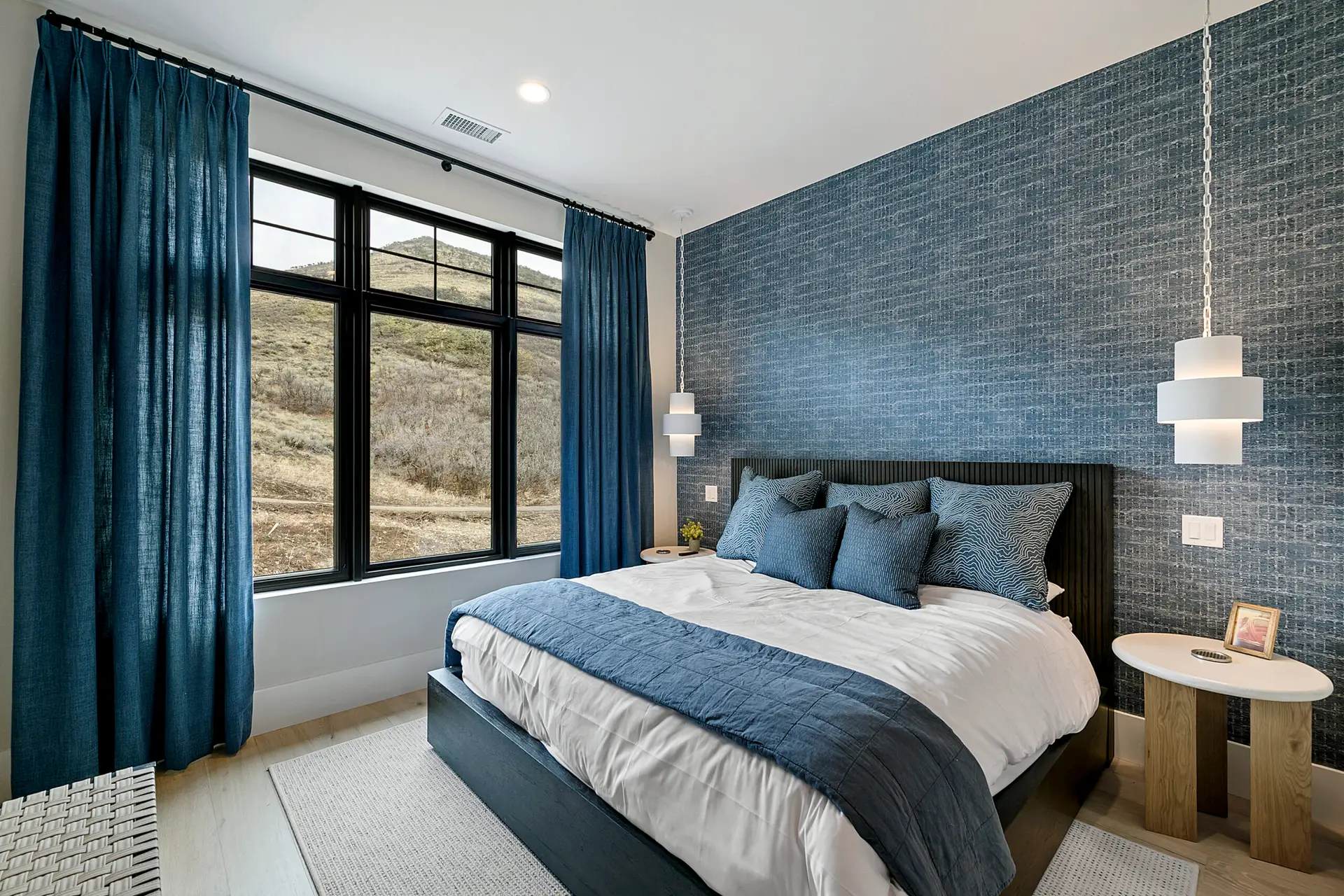 Park City, Utah, luxury bedroom with blue wallcovering wallpaper with painted walls and ceiling created by Christopher Painting, Utah, and Park City's premier painting, interior, and exterior fine-finishes artisan.