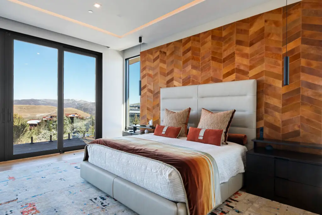 Park City, Utah, bedroom with a leather finished headboard wall, and wall painting done by Christopher Painting, Utah, and Park City's premier painting, interior, and exterior fine finishes artisan.